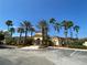 Beautiful clubhouse with palm trees and ample parking at 12016 Villanova Dr # 102, Orlando, FL 32837
