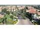 Gorgeous gated community entrance with lush landscaping at 12016 Villanova Dr # 102, Orlando, FL 32837