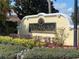Beautiful landscaping surrounds the Villanova community sign, showcasing the neighborhood's charm at 12016 Villanova Dr # 102, Orlando, FL 32837