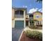 Charming condo featuring a one-car garage, screened-in balcony, and nicely landscaped surroundings at 12016 Villanova Dr # 102, Orlando, FL 32837