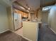 Open-concept kitchen boasts ample storage, white appliances, and stainless steel sink at 12016 Villanova Dr # 102, Orlando, FL 32837