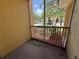 This screened in patio features a tranquil view of the lush landscaping at 12016 Villanova Dr # 102, Orlando, FL 32837