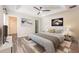 Cozy bedroom features a tray ceiling, neutral color palette, and an ensuite bathroom at 13028 Auburn Cove Ln, Orlando, FL 32828