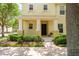 Charming front porch and walkway leading to the entrance of the home at 13028 Auburn Cove Ln, Orlando, FL 32828