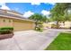 Two-car garage and driveway of this well-maintained home with a neatly manicured lawn at 13028 Auburn Cove Ln, Orlando, FL 32828