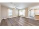 Bright living room featuring new flooring, a ceiling fan, and ample natural light at 13028 Auburn Cove Ln, Orlando, FL 32828
