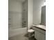 Bright bathroom featuring a shower-tub combo and a vanity with granite countertop at 1343 Dalkeith Cv, Sanford, FL 32771