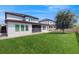 Spacious backyard featuring lush green grass and mature tree at 14124 Dove Hollow Dr, Orlando, FL 32824