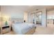 Bedroom with neutral colors and decor; includes a view of an attached bathroom at 14124 Dove Hollow Dr, Orlando, FL 32824