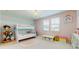 bedroom with bunk beds, whimsical decor, and bright, cheerful colors at 14124 Dove Hollow Dr, Orlando, FL 32824