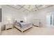 Spacious main bedroom features a tray ceiling, elegant furnishings, and bright white walls, perfect for relaxation at 14124 Dove Hollow Dr, Orlando, FL 32824
