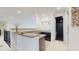 Upstairs wet bar has granite countertops, dark cabinetry, and modern fixtures at 14124 Dove Hollow Dr, Orlando, FL 32824
