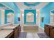 Bright bathroom featuring a sunken tub, dual sinks, tile flooring and a vibrant blue color scheme at 1542 Wescott Loop, Winter Springs, FL 32708