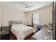 Neutral bedroom with white linens, ceiling fan and an abundance of natural light at 1542 Wescott Loop, Winter Springs, FL 32708