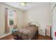 Bright bedroom with a leopard comforter, hardwood floors and a ceiling fan at 1542 Wescott Loop, Winter Springs, FL 32708