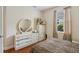 Bedroom featuring hardwood floors, a large dresser with mirror and natural light at 1542 Wescott Loop, Winter Springs, FL 32708