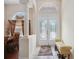 Inviting foyer featuring tile flooring, a decorative front door, and a view into the adjacent dining room at 1542 Wescott Loop, Winter Springs, FL 32708