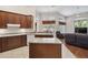 Well-equipped kitchen with island, featuring plentiful storage, countertop space, and natural light at 1542 Wescott Loop, Winter Springs, FL 32708