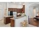 Cozy kitchen with breakfast bar and wooden stools, providing an inviting space for casual dining at 1542 Wescott Loop, Winter Springs, FL 32708