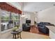 Bright living room featuring ample natural light, hardwood floors and comfortable seating at 1542 Wescott Loop, Winter Springs, FL 32708