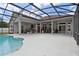 An inviting pool with a screen enclosure and plenty of patio space at 1542 Wescott Loop, Winter Springs, FL 32708