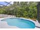 A well-maintained pool with a spa and a screen enclosure offering ample privacy at 1542 Wescott Loop, Winter Springs, FL 32708