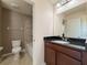 Cozy bathroom with tile floor, standard toilet, and granite countertop at 1546 Water Elm Ct, Orlando, FL 32825