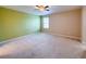Bedroom boasts carpeted floors, a ceiling fan, and neutral paint at 1546 Water Elm Ct, Orlando, FL 32825