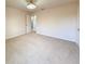 Spacious bedroom with standard ceiling light, carpet and neutral color palette at 1546 Water Elm Ct, Orlando, FL 32825