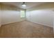 Carpeted bedroom with neutral paint and standard ceiling light fixture at 1546 Water Elm Ct, Orlando, FL 32825