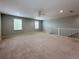 Large carpeted bonus room with two windows and a neutral color palette at 1546 Water Elm Ct, Orlando, FL 32825
