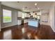 Bright eat-in kitchen featuring white cabinets, stainless appliances, and a center island at 1546 Water Elm Ct, Orlando, FL 32825