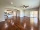 Open floor plan showcasing hardwood floors and seamless flow to a modern kitchen at 1546 Water Elm Ct, Orlando, FL 32825