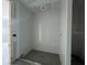 A bathroom featuring tiled walls and a tiled floor with plumbing for fixtures not yet installed at 1635 Cane Bamboo Drive, St Cloud, FL 34771