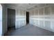 Bedroom with drywall, showcasing open doorways, ready for paint and flooring at 1635 Cane Bamboo Drive, St Cloud, FL 34771
