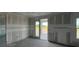 Bedroom with plasterboard walls and patio doors at 1635 Cane Bamboo Drive, St Cloud, FL 34771