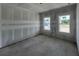 Bedroom with plasterboard, and bright windows offer natural light at 1635 Cane Bamboo Drive, St Cloud, FL 34771