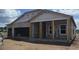 Exterior view of the house under construction, showcasing block walls and roof framing at 1635 Cane Bamboo Drive, St Cloud, FL 34771