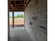 Interior of home under construction with concrete floors, unfinished block walls, and wood framing at 1635 Cane Bamboo Drive, St Cloud, FL 34771