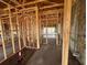 Framing of new home construction showing the layout of rooms and initial construction of the interior walls at 1635 Cane Bamboo Drive, St Cloud, FL 34771