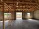 Spacious interior of a home under construction with concrete floors, block walls and wood framing at 1635 Cane Bamboo Drive, St Cloud, FL 34771
