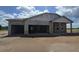 View of home in progress with visible block walls and partial roof construction at 1635 Cane Bamboo Drive, St Cloud, FL 34771