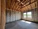 New home construction features framed room, concrete flooring, block walls, and two double-hung windows at 1635 Cane Bamboo Drive, St Cloud, FL 34771