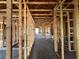 Interior view of framing and concrete flooring during the construction phase at 1635 Cane Bamboo Drive, St Cloud, FL 34771
