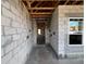 Interior view of a home under construction, showcasing concrete floors and block walls at 1635 Cane Bamboo Drive, St Cloud, FL 34771