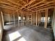 Spacious new home construction showing the framing, concrete flooring, and the layout of rooms at 1635 Cane Bamboo Drive, St Cloud, FL 34771