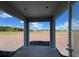 Covered outdoor patio area with view of green space and blue sky at 1635 Cane Bamboo Drive, St Cloud, FL 34771