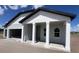 Charming single-story home featuring a covered porch with columns and a modern exterior at 1635 Cane Bamboo Drive, St Cloud, FL 34771