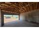 New home construction showing an attached garage with block walls, unfinished ceiling, and concrete floor at 1635 Cane Bamboo Drive, St Cloud, FL 34771