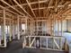 Unfinished interior displaying exposed wood framing and concrete flooring at 1635 Cane Bamboo Drive, St Cloud, FL 34771